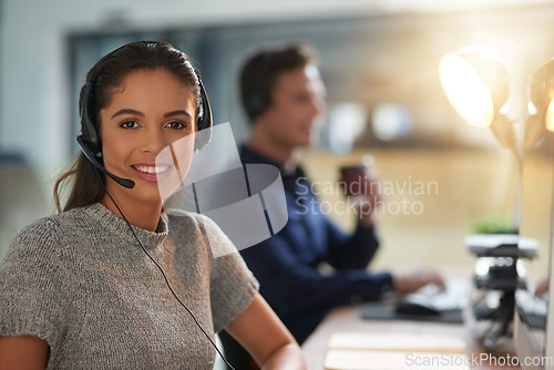 Image of Call center, happy and portrait of woman at computer for customer service, help desk and consulting. Smile, night and ecommerce with employee in office for contact us, telemarketing and receptionist