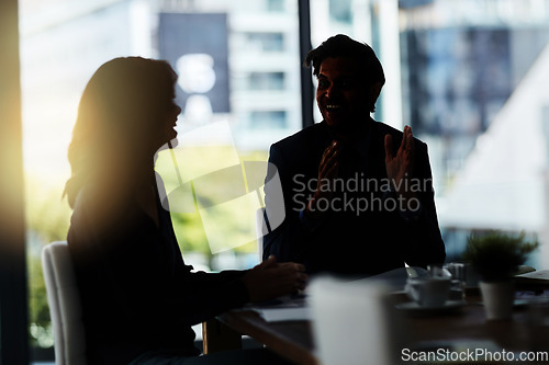 Image of Dark, happy and business people in meeting at office for discussion, planning and conversation. Corporate workplace, collaboration and man and woman in conference room for morning communication