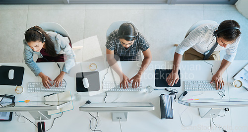 Image of Call center, computer and top view with business people in office for communication, customer service and contact us. Help desk, online and team of employee in agency for consulting and advisory