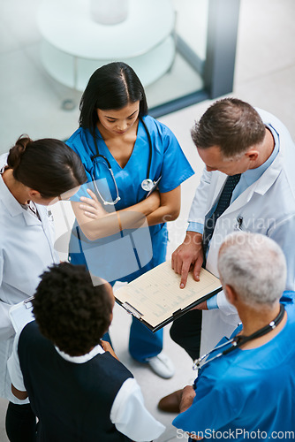 Image of Teamwork, clipboard and medical with doctors in hospital for consulting, planning and communication. Medicine, healthcare and checklist with group of people for support, review and analysis