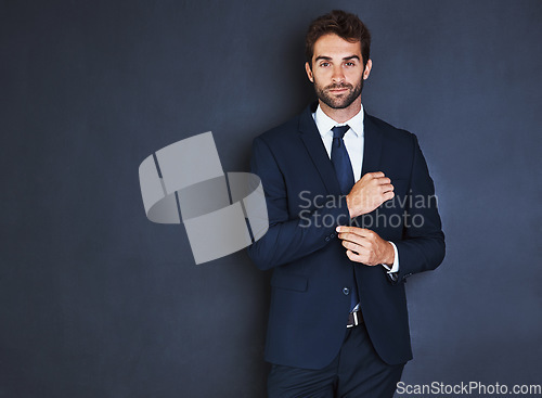 Image of Portrait, mockup and a formal business man in studio on a blue background for corporate fashion on mock up space. Success, professional and confident young male employee in a suit for executive style