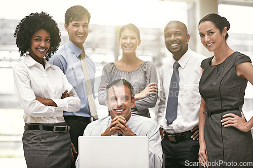 Image of Diversity, portrait of businesspeople in office and team work with laptop at desk. Teamwork or collaboration, business meeting or group and colleagues or coworkers smiling together at workplace