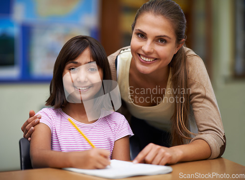 Image of Portrait, education or school with a student and teacher in a classroom together for writing or child development. Study, learning and teaching with a woman educator helping a girl child in class