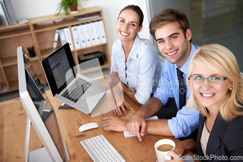 Image of Portrait, teamwork and happy business people working at desk, computer and planning for collaboration in office. Employees, desktop and smile in company for professional management, project and pride