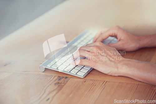 Image of Hands of person, keyboard and typing on desk for digital research, website blog and internet planning. Closeup, fingers and computer buttons for online network, email and desktop technology at table