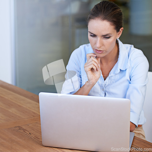 Image of Business woman, thinking and serious at laptop to research ideas, brainstorming solution and online planning. Focused female worker at computer for decision, analysis or reading information at mockup