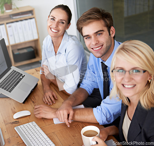Image of Portrait, happy collaboration and business people at desk, computer and office planning with pride. Group of employees, desktop and teamwork in company for professional management, project and smile