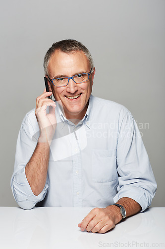Image of Senior businessman, phone call and studio portrait with happiness, smile and listen by gray background. Elderly man, happy and excited face for contact, chat and smartphone for networking by backdrop
