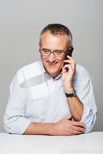 Image of Senior business man, phone call and studio with happiness, smile and listening by gray background. Elderly guy, happy and excited face for contact, chat and smartphone for communication by backdrop