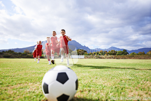 Image of Running, fitness and sports with children and soccer ball on field for training, competition and teamwork mockup. Game, summer and action with football player on pitch for goals, energy and kids