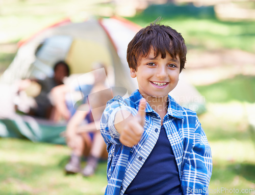 Image of Happy child, portrait smile and thumbs up for camping success, winning or victory in nature. Little boy or kid smiling and showing thumb emoji, yes sign or like for camp setup, victory or approval