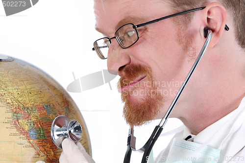 Image of funny doctor examine a globe 