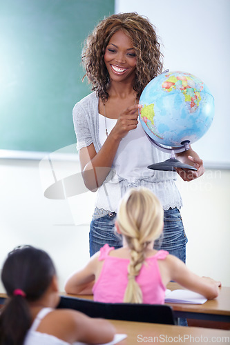 Image of Geography, globe and teacher with children in classroom for education, world learning and happy earth knowledge. African person with school kids for teaching global, planet and map location