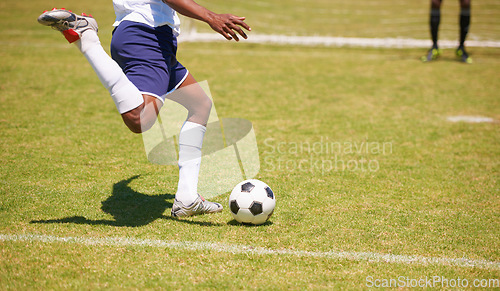 Image of Feet, soccer player and penalty kick on field for goal, competition or game for sports career. Man, football and shooting ball on grass pitch with accuracy for training, workout and contest outdoor