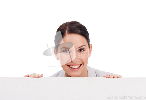 Image of Portrait, mockup board and woman peeking over in studio isolated on a white background. Face, poster and happy female person with copy space, advertising and marketing, promotion and commercial.