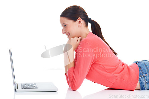 Image of Laptop, studio floor and happy woman watch comedy movie, internet meme or streaming social media video. Digital website, relax model smile and profile girl reading comic isolated on white background