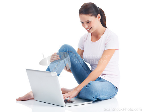 Image of Laptop, studio ground and happy woman typing internet, website or digital web search for e commerce research project. Online shopping, relax and model reading sales promo isolated on white background