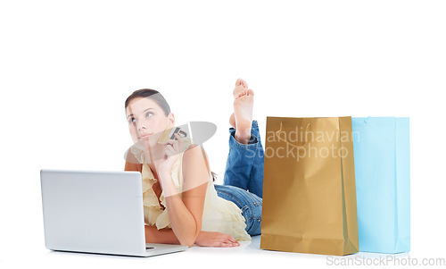 Image of Online shopping laptop, credit card and woman thinking on floor about fintech payment, sales or retail website. Ecommerce store, gift bag and customer person isolated on white studio background