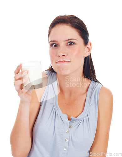 Image of Portrait, funny woman and glass of milk for vitamin D healthcare benefits, bone health or nutritionist hydration drink. Calcium dairy product, wellness and studio model isolated on white background