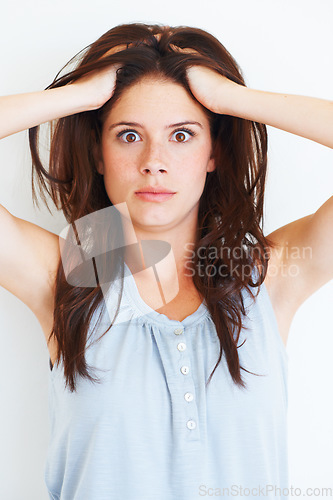 Image of Portrait, shocked and woman touching her hair in studio isolated on a white background. Wow, omg and face of female person with surprised expression, emoji and unexpected news, announcement and wtf.