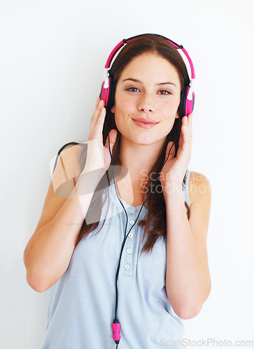 Image of Music headphones, portrait and happy woman listen to fun girl song, wellness audio podcast or radio sound. Studio smile, freedom and gen z model streaming edm playlist isolated on white background