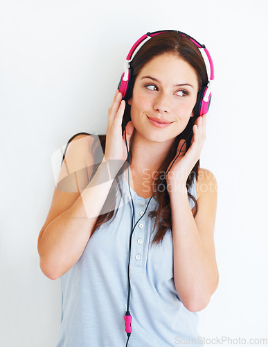 Image of Music headphones, studio and happy woman listening to fun girl song, wellness audio podcast or radio sound. Freedom smile, happiness or gen z model streaming edm playlist isolated on white background