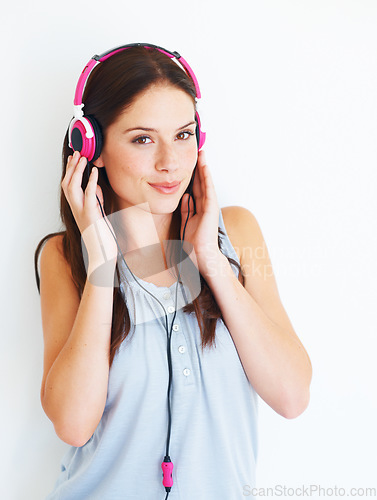 Image of Music headphones, smile and happy woman listening to fun girl song, wellness audio podcast or radio sound. Studio freedom, happiness or gen z model streaming edm playlist isolated on white background
