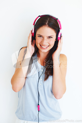 Image of Music headphones, happiness and woman portrait listening to girl song, wellness audio podcast or radio sound. Happy studio smile, freedom and model streaming edm playlist isolated on white background