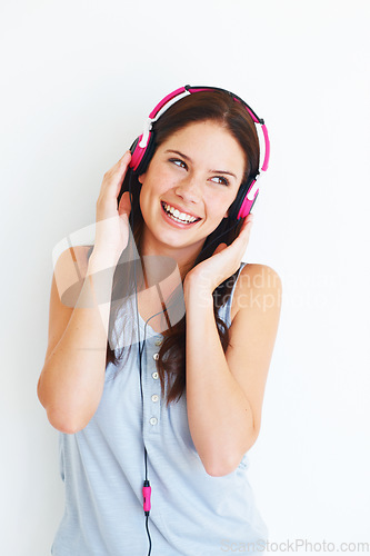 Image of Music headphones, fun and happy woman listening to pop girl song, wellness audio podcast or radio sound. Studio smile, youth freedom or gen z model streaming edm playlist isolated on white background