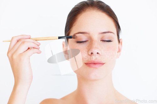 Image of Makeup brush, face beauty or studio woman relax with cosmetics product, facial skincare glow or eyeshadow application. Natural care, spa salon or aesthetic model girl isolated on white background