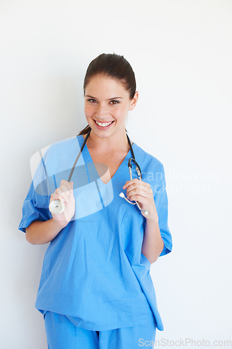 Image of Medical portrait, stethoscope and nurse happy for nursing career, studio healthcare or cardiology health. Medicine doctor, caregiver woman or hospital surgeon with smile isolated on white background