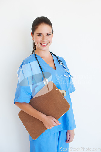 Image of Studio portrait, happy and nurse with clipboard checklist for nursing healthcare, medical hospital or cardiology health. Medicine doctor, caregiver woman or happy surgeon isolated on white background