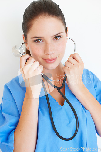 Image of Studio portrait, listening and nurse with stethoscope for nursing career, medical healthcare or cardiology health. Medicine doctor, caregiver woman or hospital surgeon isolated on white background