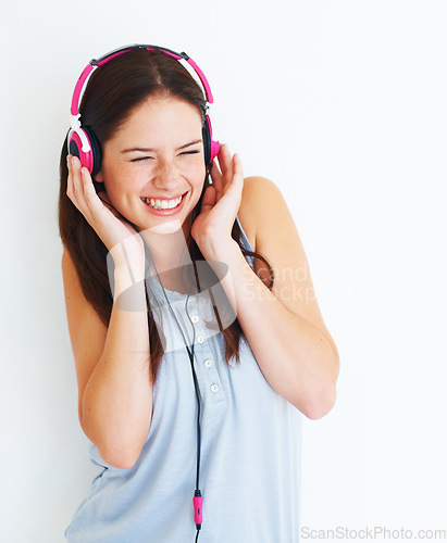 Image of Music headphones, loud and happy woman listening to fun girl song, wellness audio podcast or radio sound. Happiness, studio freedom and gen z model streaming edm playlist isolated on white background