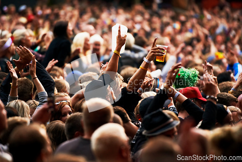 Image of Dance, music festival and party with crowd at concert and cheering for dj show and rave performance. Rock, energy and hands of people dancing in audience for celebration, disco and techno event