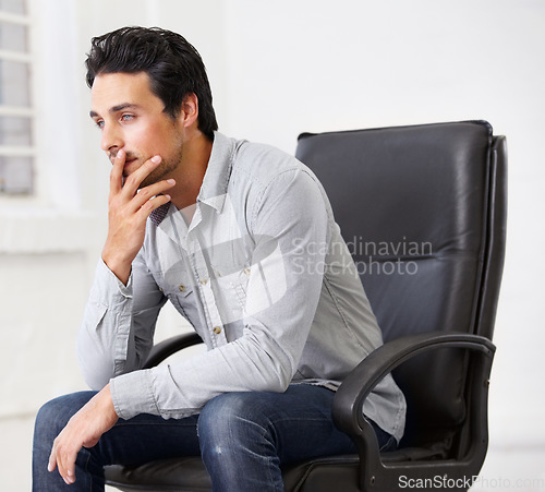 Image of Thinking, business and man on chair in office with idea for career, job or work management. Professional, male entrepreneur and decision or doubt and manager, ceo or person sitting in workplace.