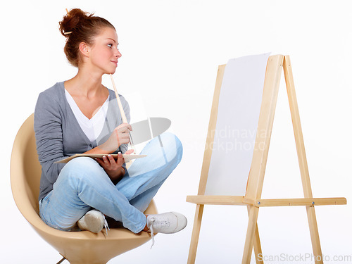 Image of Woman thinking, painting and art canvas in studio for creativity and talent with paint brush for color. Female artist or painter isolated on a white background for creative work and mockup ideas