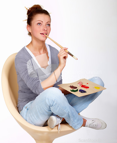 Image of Thinking, painting and art ideas in studio for creativity, talent and a paint brush for color. Female artist or painter person isolated on a white background for creative work or project to relax