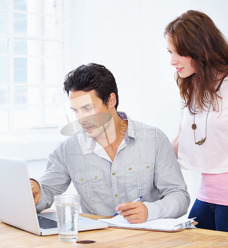 Image of Laptop, advice and business people thinking, explaining and review of online proposal, planning and brainstorming in office. Professional woman and partner or boss on computer with ideas or feedback