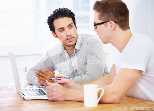 Image of Computer, planning and business man with partner in teamwork, collaboration and meeting for project ideas. People or startup clients talking of website design on laptop or software support in office