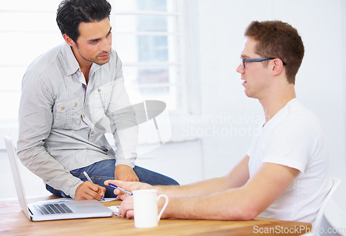 Image of Laptop, meeting and manager or people planning, discussion and tech feedback, mentor help or website design. Software, computer and IT professional man with boss talking or advice at his office desk