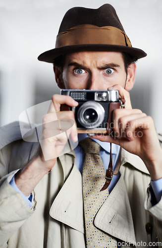 Image of Vintage agent man, street and camera for investigation, inspection or suspicious journalist at job. Private investigator, secret photographer and retro paparazzi with focus, surveillance or portrait