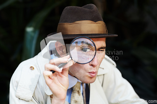 Image of Private investigator, eye in magnifying glass and portrait of man for detective, searching and looking. Spy, investigation and male person with magnifier for secrets, information and mystery clue