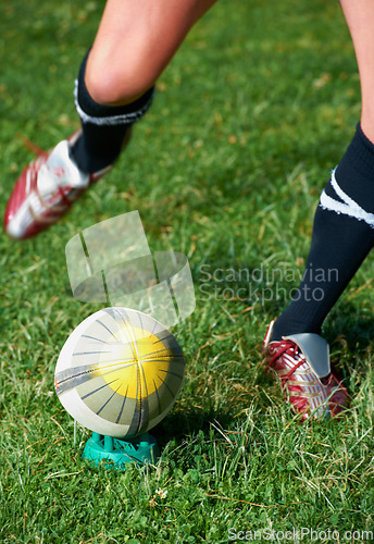 Image of Rugby kick, feet and man with a sports ball outdoor on a pitch for action, goal or score. Male athlete person playing in sport competition, game or start training for fitness, workout or exercise