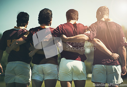 Image of Rugby team, sports and men together outdoor on a pitch for scrum, hug or huddle. Male athlete group playing in sport competition, game or training match for fitness, workout or teamwork exercise