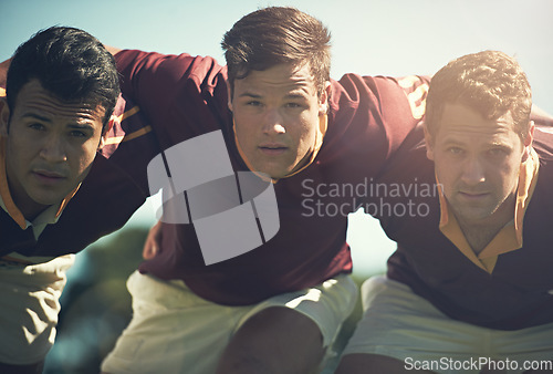 Image of Rugby team, portrait and sports men together outdoor on a pitch for scrum, hug or teamwork. Male athlete group playing in sport competition, game or training match for fitness, workout or exercise