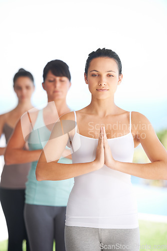 Image of Peace, zen meditation and woman with sport and yoga exercise outdoor with a pilates instructor. Spiritual, namaste and wellness of training, workout and fitness group feeling calm from meditating