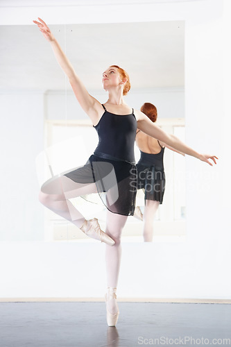 Image of Ballerina, woman and ballet class with dancing, young dancer in rehearsal with art and grace at studio. Female person in pointe pose, balance and training for performance with creativity and fitness