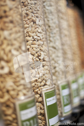 Image of Food, grocery and shopping with nuts in supermarket for health, nutrition and retail offer. Choice, storage and vegan with grain products in zero waste packaging store for wellness, vegan and organic