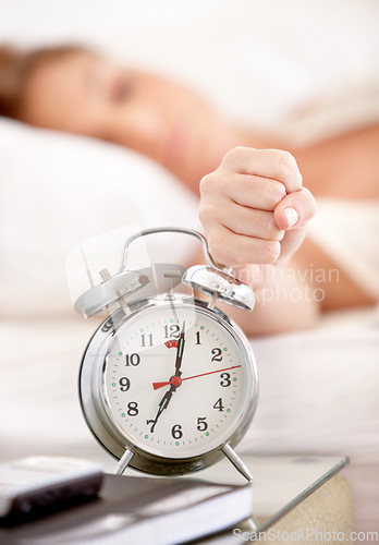 Image of Snooze, alarm and hand of woman in morning wake up with tired, exhausted and no sleep at home. Depression, sleeping and annoyed female person with anxiety, frustrated and stress hit bedroom clock